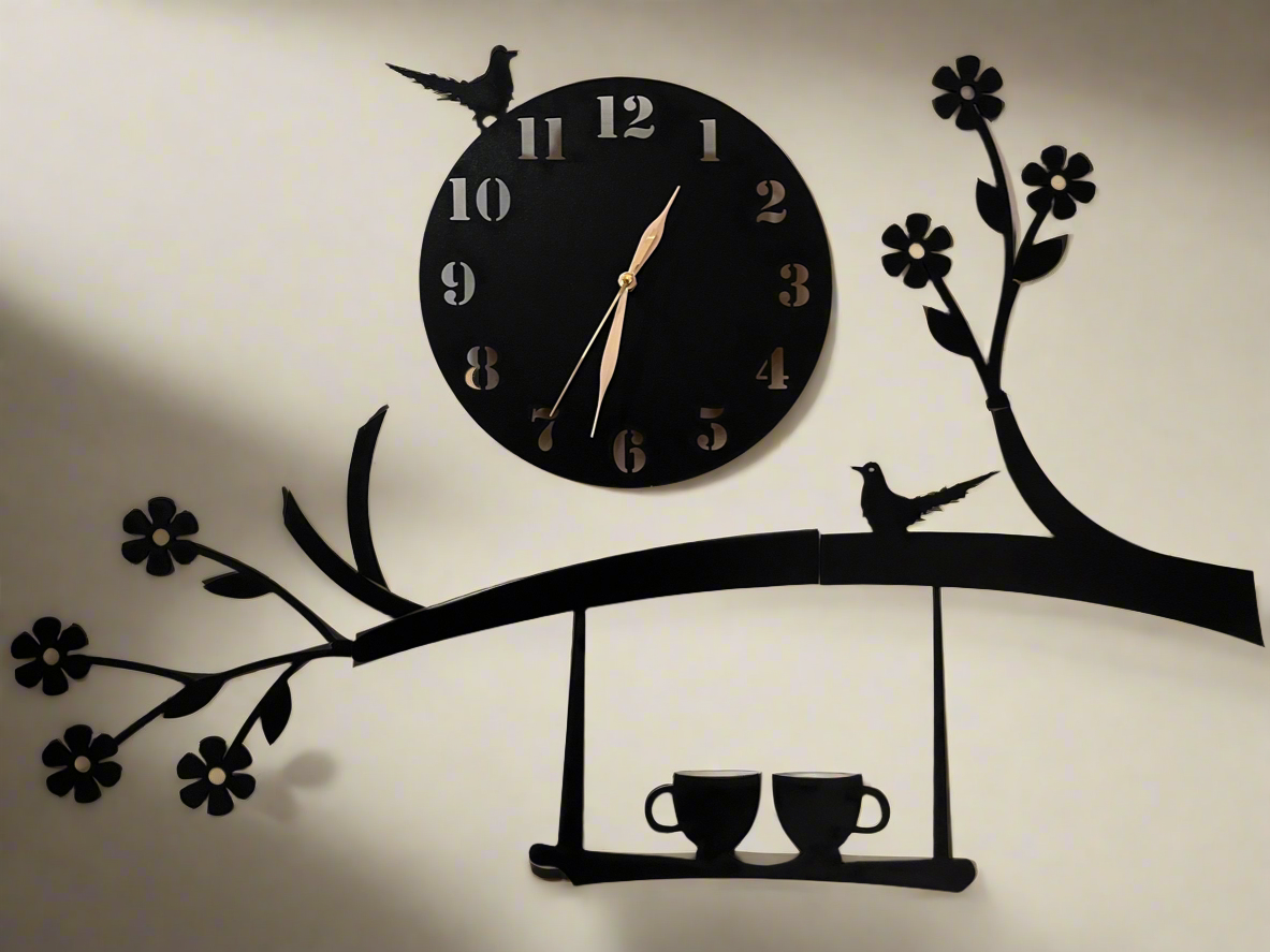 Decorative wall clock with birds, flowers, and cups on a branch design.
